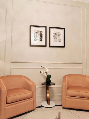 two chairs and a table in a room at Frederick House Hotel in Edinburgh