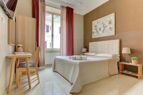 a bedroom with a large bed and a window at Happy Seasons in Rome