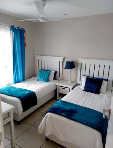 Postel nebo postele na pokoji v ubytování Indigo Bay 29