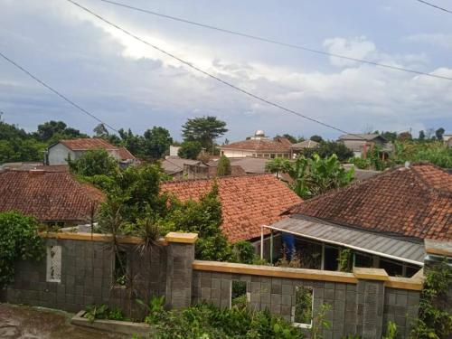 a group of houses with roofs at Agus Homestay in Cibeunjing