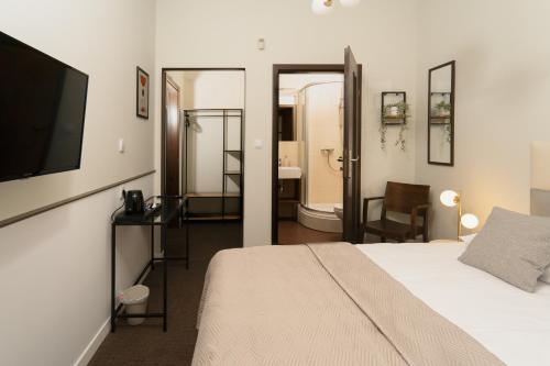 Llit o llits en una habitació de Expo Apartments