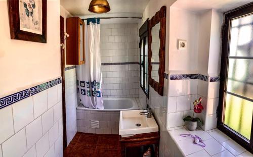 a bathroom with a sink and a bath tub at Casa La Caoba in Ruidera