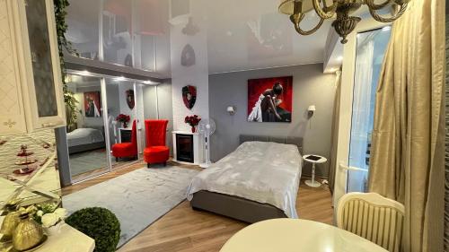 a bedroom with a bed and a large mirror at Last Floor Apartments in Narva-Jõesuu