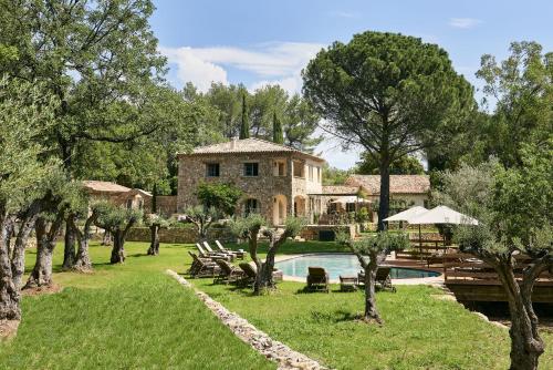 a villa with a swimming pool and a resort at Château de Berne in Lorgues