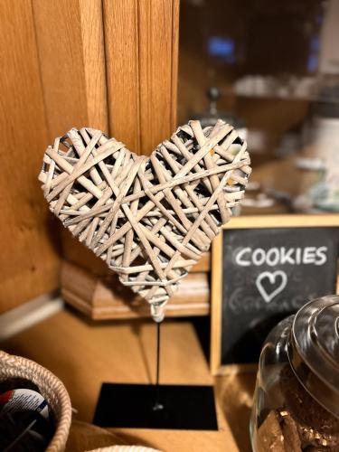 a heart made out of wood sitting on a table at Hotel Fränkischer Hof in Kitzingen