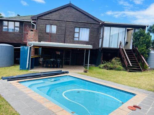 a house with a swimming pool in the yard at Bella Hideaway in East London