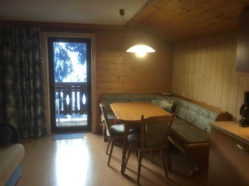 a living room with a couch and a table at Planerhof in Görtschach