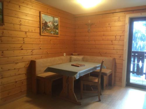 a small dining room with a table and chairs at Planerhof in Görtschach