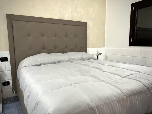 Ένα ή περισσότερα κρεβάτια σε δωμάτιο στο Hotel Capo Campolato
