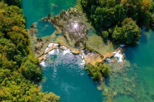 an island in the middle of a body of water at Bed & Breakfast Zeleni Kut in Gornji Zvečaj