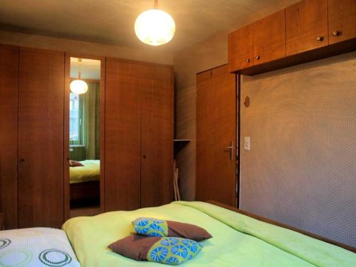 a bedroom with a bed with two pillows on it at Ferienwohnung Angelika in Bad Schallerbach