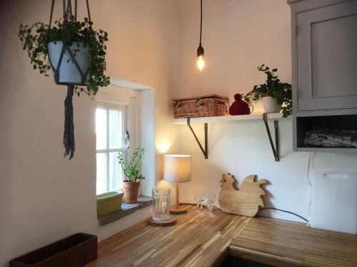 a room with a table with a lamp and a window at Sanctuary Cottage at Blacko in Barrowford