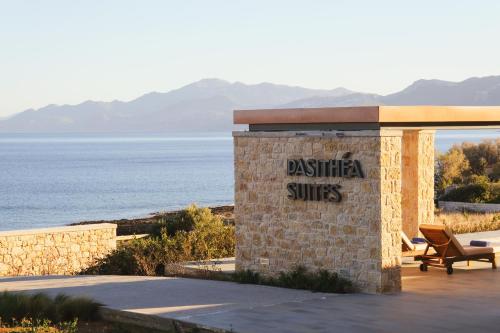a building with a sign that reads disaster suites at Pasithea Suites in Monemvasia