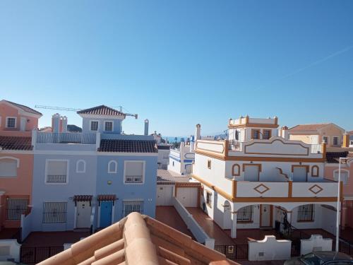 a view of roofs of buildings in a city at Casa Calypso San Juan de los Terreros in San Juan de los Terreros