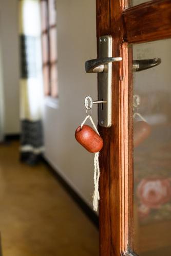 a door knob with a lock on a door at Relax Beach House in Tangalle