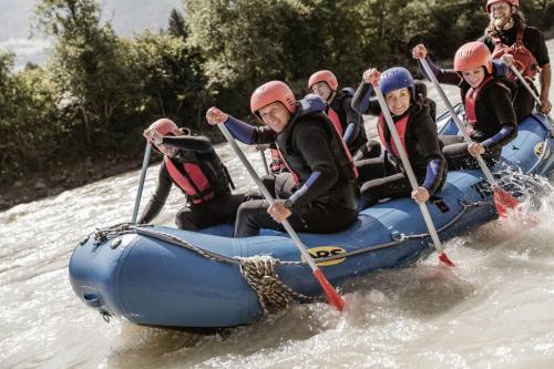 a group of people in a raft on a river at Ferienwohnung Pangratz in Tarrenz
