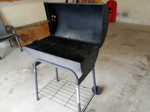 a barbecue grill sitting in a room at Umundum Hütte in Katsch Oberdorf