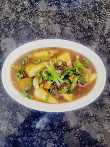 a bowl of soup on a table at THE HEART OF HEAVEN in Āmbavna