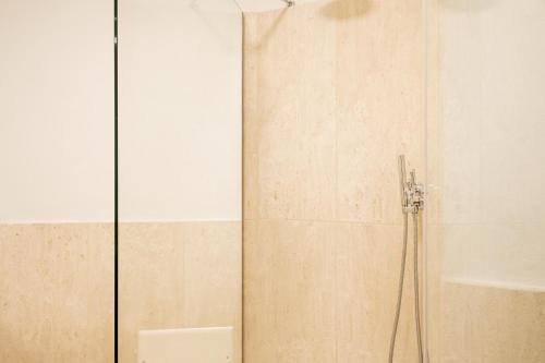 a shower with a glass door in a bathroom at [CALA DI VOLPE] Vista Mare e Piscina in Abbiadori