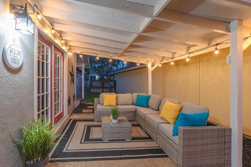 a patio with a couch on the side of a building at Stunning Pool Overlooking Golf Course & Game Room in San Antonio