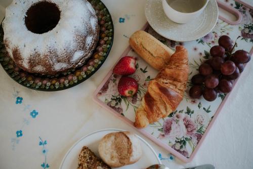 a table with a plate of bread and a cup of coffee at El Rincón de Baco in Alesanco