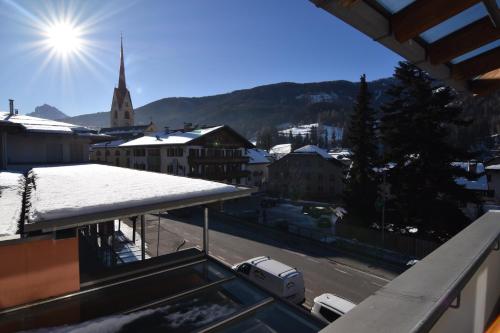 a view of a city with a snow covered roof at T&B MOUNTAIN VIEW in Monguelfo
