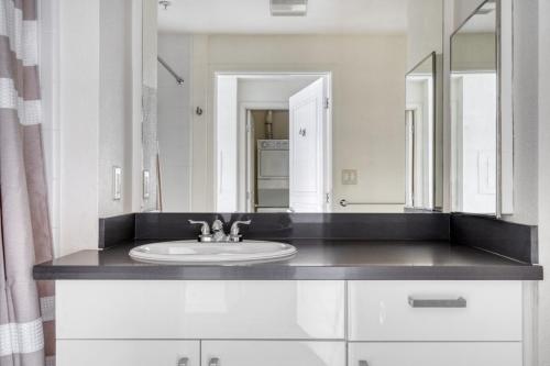 a bathroom with a sink and a mirror at Rincon Hill 1BR w Gym Lounge nr Embarcadero SFO-763 in San Francisco