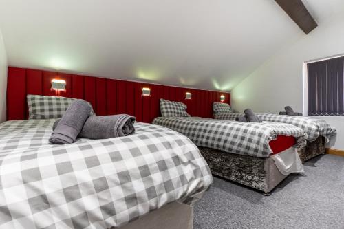 מיטה או מיטות בחדר ב-The Breckfield