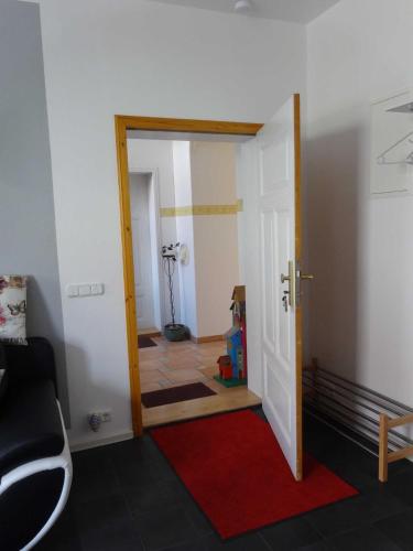 a hallway with a door open to a room at Ferienwohnungen Haus Leonore in Stendal