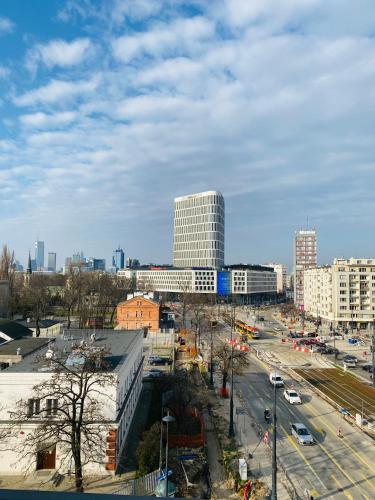 a view of a city with buildings and a street at Olivia Apartments - Słoneczny apartament w centrum Warszawy, Plac Unii Lubelskiej, Łazienki Królewskie, Pole Mokotowskie - 24h check-in in Warsaw