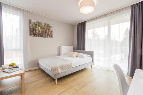 Katil atau katil-katil dalam bilik di APARTAMENTY MIERZEJA - Stegna Forest, blisko lasu, Bezpłatny Meleks