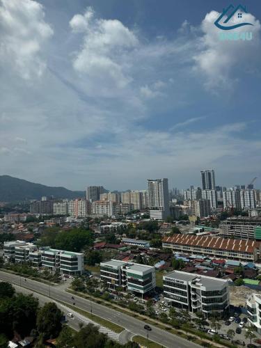 a city with tall buildings and a road with cars at Urban Suites @ George Town Penang by BNB4U in George Town