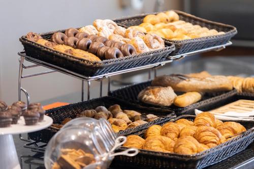 a bunch of different types of bread and pastries at Catalonia Majórica in Palma de Mallorca