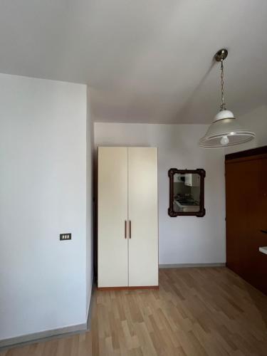 a room with a white cabinet and a mirror at Arco Sallustio 2.0 in Monopoli