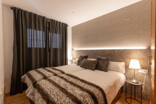 a bedroom with a large bed and a window at BiBo Suites Sierra Nevada in Sierra Nevada