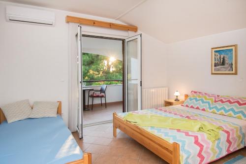 Ένα ή περισσότερα κρεβάτια σε δωμάτιο στο Bed and Breakfast Ritosa