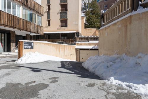 a pile of snow on the side of a street at BiBo Suites Sierra Nevada in Sierra Nevada