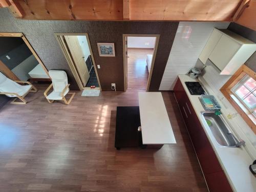 an aerial view of a kitchen and a living room at Santa Monica Pension in Kokhae