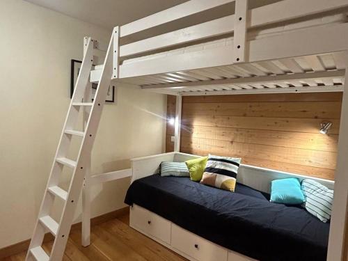 a bedroom with a bunk bed and a ladder at Appartement Briançon, 3 pièces, 8 personnes - FR-1-330C-84 in Briançon