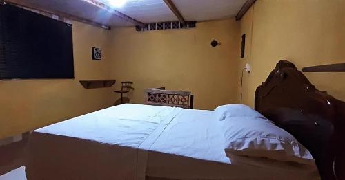 Postel nebo postele na pokoji v ubytování ROSÁRIO TEMPORADA Hostel