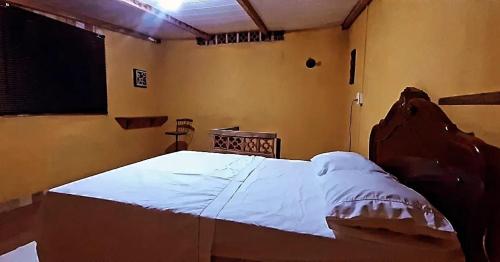 Postel nebo postele na pokoji v ubytování ROSÁRIO TEMPORADA Hostel