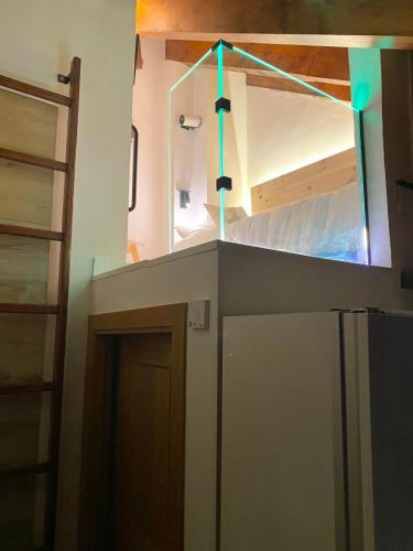 a room with a bunk bed and a room with a door at CAL DOMÈNEC RIALP - Dúplex con encanto - Se admiten mascotas in Rialp