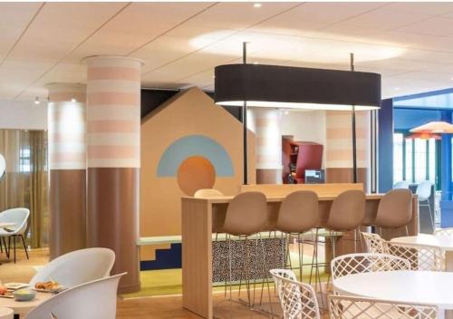 Un lugar para sentarse en Sublime appartement à 5 minutes de bus de Disneyland