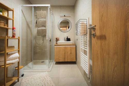 a bathroom with a shower and a sink at GRAY APARTMENT in Banská Bystrica