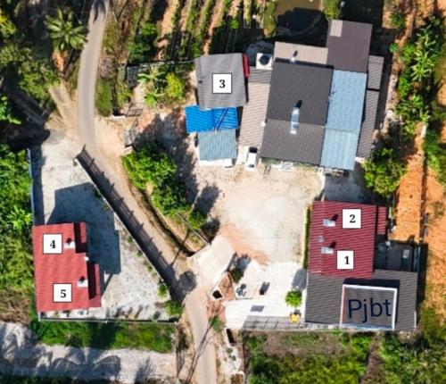 an aerial view of a house with roofs at Sacha Homestay in Baling
