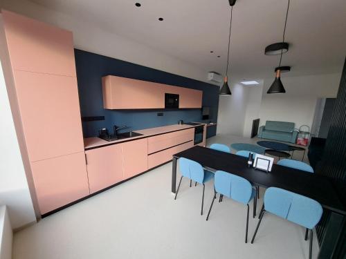 a kitchen with a table and chairs in a room at Matea in Břeclav