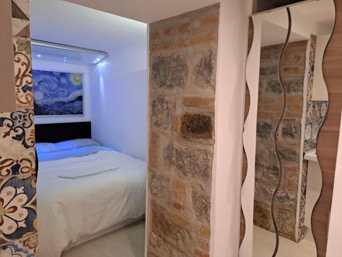 Ein Bett oder Betten in einem Zimmer der Unterkunft Loft Università