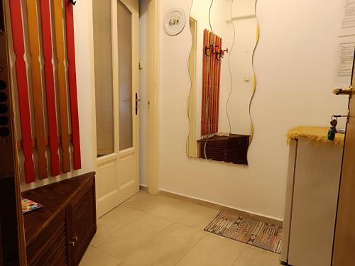 a room with a hallway with a door and a room with at Flat in historic villa with your own private garden, near City Park in Budapest