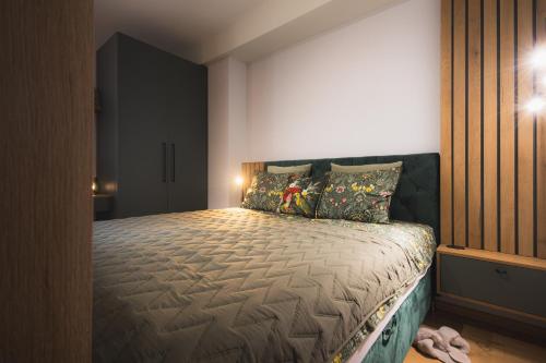 a bedroom with a large bed in a room at GREEN APARTMENT in Banská Bystrica