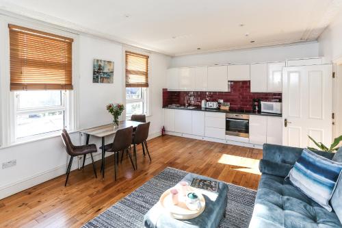 a living room with a couch and a table at Newbridge Road, One bedroom Apartment in Bath